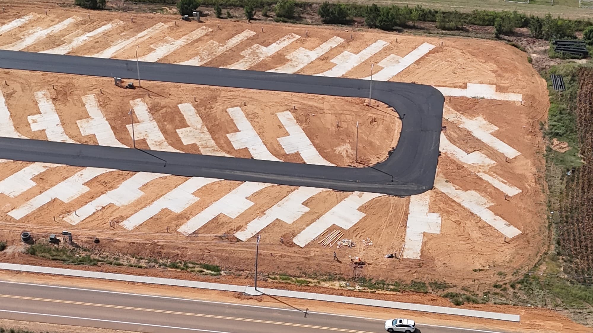 Aerial detail of the paved loop road and rows of concrete RV pads